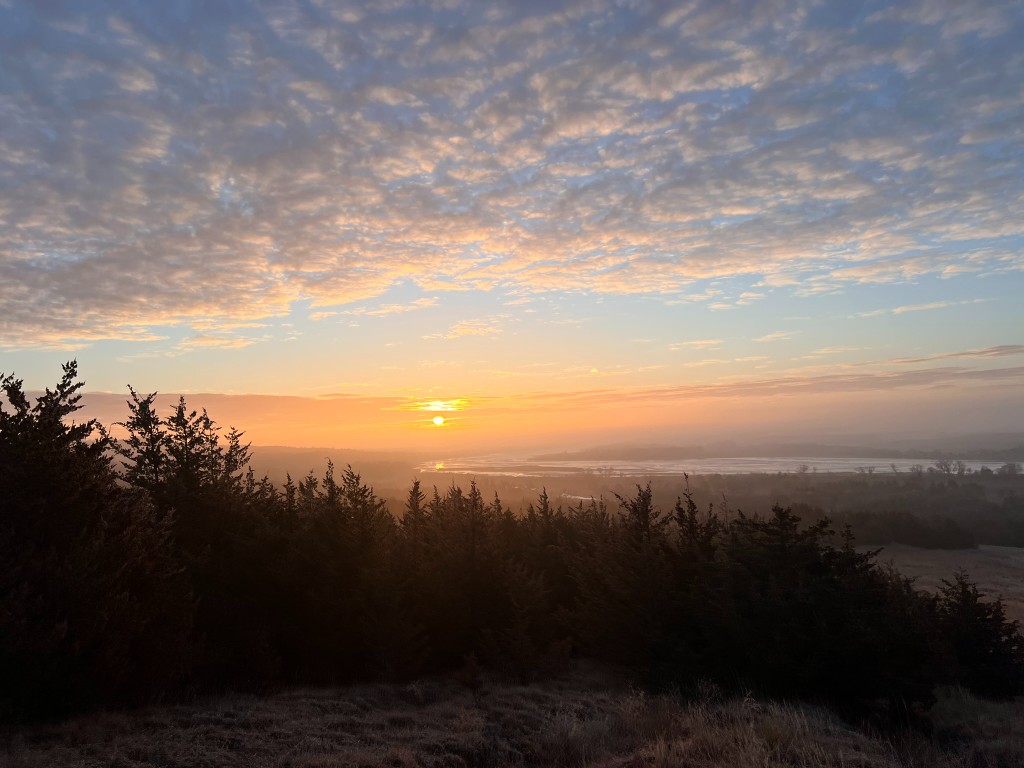 Nebraska landscape at sunrise with trees and river valley